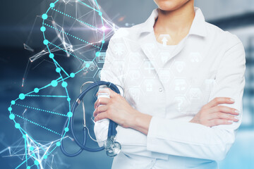Female doctor with stethoscope, folded arms and abstract glowing DNA hologram on blurry blue...