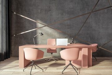 Sunny stylish workspace with peach color table and chairs, modern laptop and brown wall decorated by pink gold lines. 3D rendering