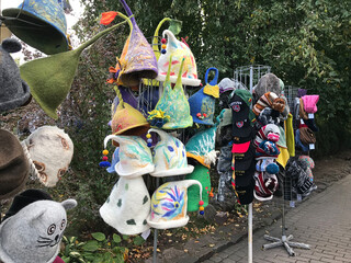 Trakai, Lithuania - September 14, 2019:  A variety of cute fabric hats are on sale on the lakefront...