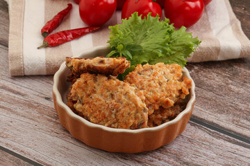 Fried salmonn cutlet in the bowl