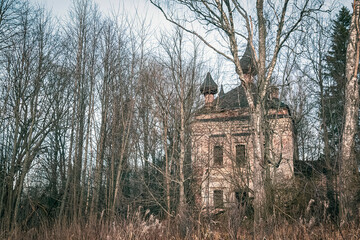 Landscape an abandoned temple in the forest in late autumn