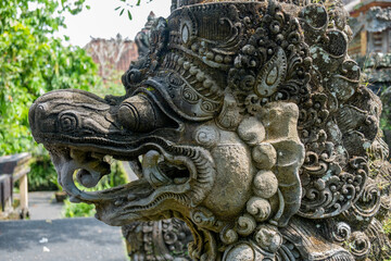 old statue of mithycal creature on bali, indonesia