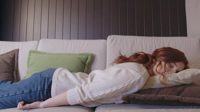 Exhausted Or Bored Young Sleepy Woman Falls Down On Sofa. Apathetic Tired Lazy Lady Sleeping On Couch At Home Alone. Funny Girl Lying Asleep Feeling Lack Of Motivation, Fatigue Or Depression Concept