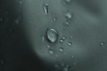 waterproof fabric with waterdrops. non woven fabric water texture background Water drops on waterproof nylon fabric. soft focus