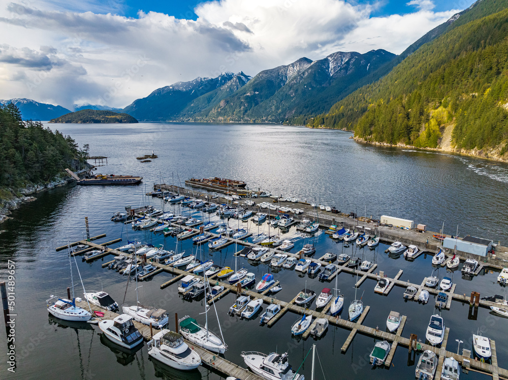 Wall mural Aerial shot of the mountains and moored boats and yachts at the harbor of Horseshoe Bay, BC, Canada