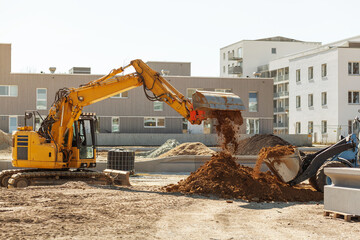 Excavator Working on Construction Site. Crawler Excavator Throws Ground on pile on Urban Place.