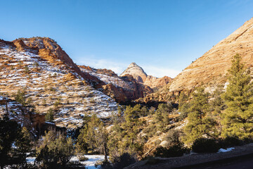Scenic mountain landscape with melting snow on a sunny day