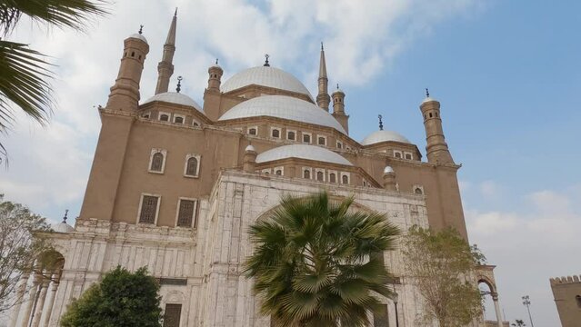 Magnificent mosque in citadel of Saladin with people walking by. Cairo, Egypt. Low Angle