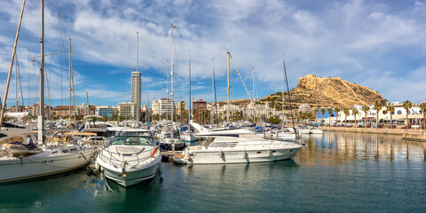 Fototapeta na wymiar Alicante Port d'Alacant marina with boats and view of castle Castillo travel traveling holidays vacation panorama in Spain