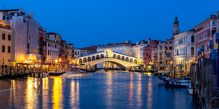 Venice Rialto bridge over Canal Grande with gondola travel traveling holidays vacation town panorama at night in Italy © Markus Mainka