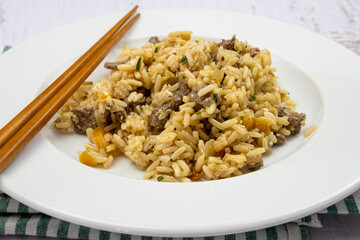beef fried rice in a plate on a table