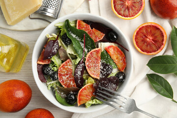 Delicious sicilian orange salad served on white wooden table, flat lay