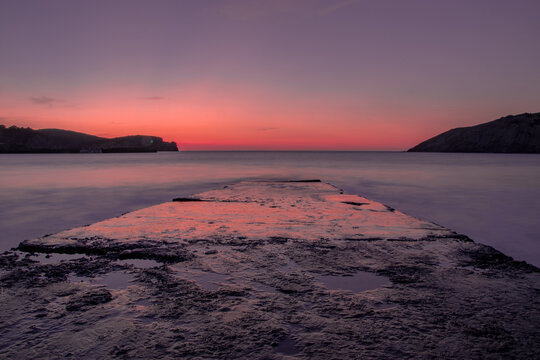 Long exposure shot of a magical sunset at Gorliz beach, Basque Country