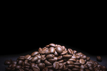 Close-up coffee beans on black background.