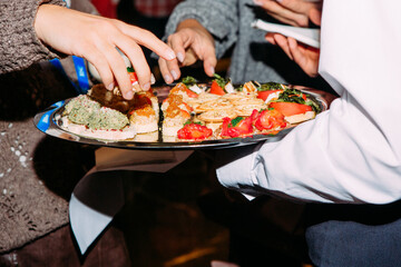 cupcakes miscellaneous appetizer plate waiter hands inside