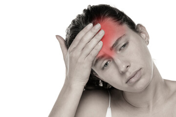 Young woman with headache on a white background