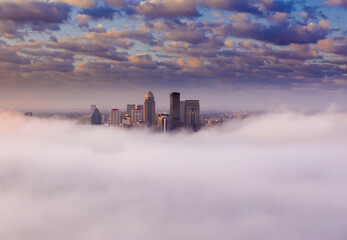 The city of Louisville in the clouds with amazing view of the cloudscape, Kentucky, USA - obrazy, fototapety, plakaty
