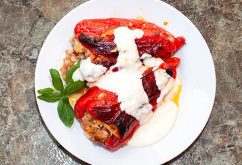 Stuffed peppers with dairy construction. A traditional dish in the Bulgarian national cuisine, which is prepared with red or green peppers, minced meat, rice and spices.