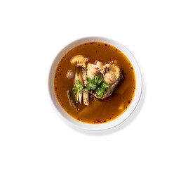 Top view hot and spicy fish soup, tom yam popular Thai seafood isolated on white background, clipping path