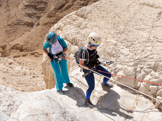 Experienced athletes start the descent with the equipment for snapping in the mountains of the...