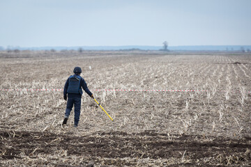 Ukrainian sapper clears mines at the site of recent fighting between the Russian and Ukrainian...