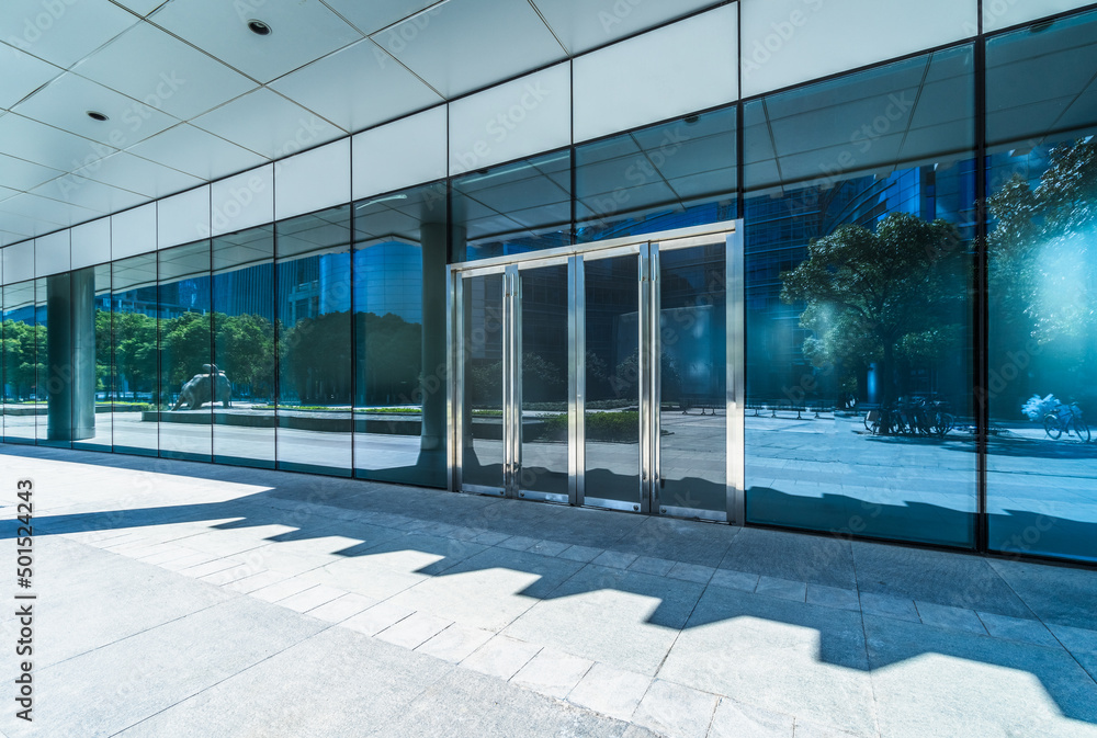 Wall mural empty pavement front of the modern office entrance.