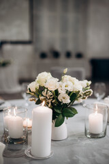 elegant flower arrangements on the reception desk of the wedding table