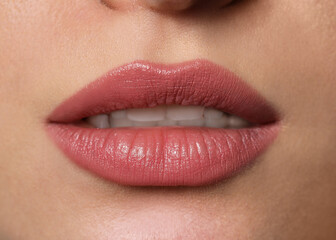 Young woman with beautiful plump lips, closeup