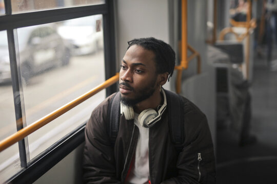 young man in a tram in the city