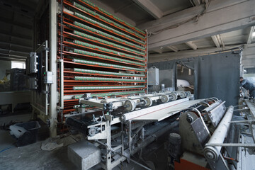 Automated machine at factory for production of toilet paper and other paper products.