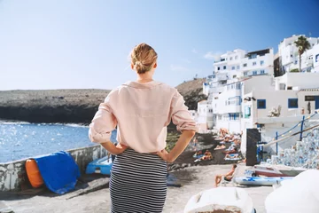 Printed kitchen splashbacks Canary Islands Woman enjoys vacation on stone beach in Tufia small old village (like Santorini in Greece) in Gran Canaria, Spain. Tourist during summer holiday in authentic fishing town in Canary Islands