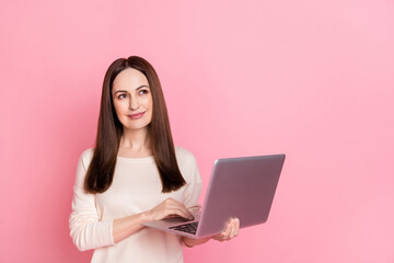 Photo of beautiful dreamy woman hold laptop home based business thoughtful creative job wear pullover isolated pink color background