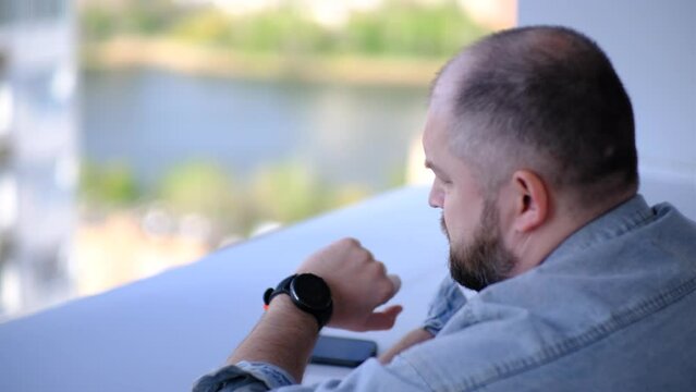 a man looks at the clock