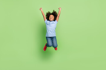 Full length body size view of beautiful cheerful pre-teen girl jumping having fun isolated over...