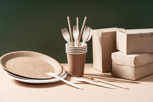Eco-friendly kraft paper tableware. Dishes, paper cups, fast food containers and cutlery. Recycling or environmentally friendly concept. Zero waste concept