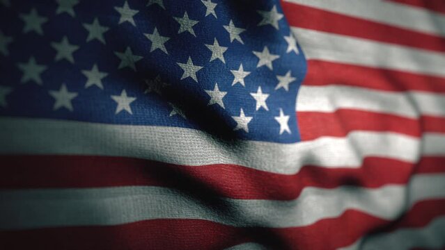 American flag is waving close up. USA flag blowing in the wind. For memorial day or 4th of July. United States sign