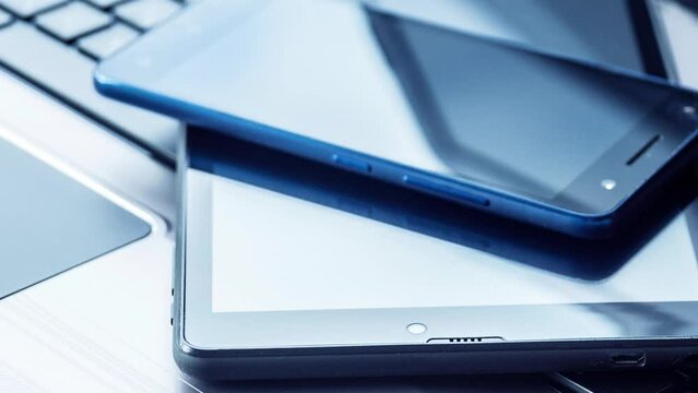 Laptop with tablet and smartphone on white background