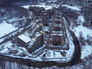 Aerial view of residental complex Novogorsk Olympic village in the evening at sunset. River like a...