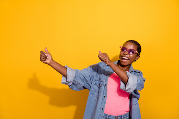 Naklejka premium Portrait of funky cheerful girl enjoy clubbing spend free time isolated on yellow color background