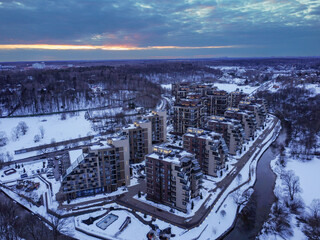Aerial view of residental complex Novogorsk Olympic village in the evening at sunset. River like a...