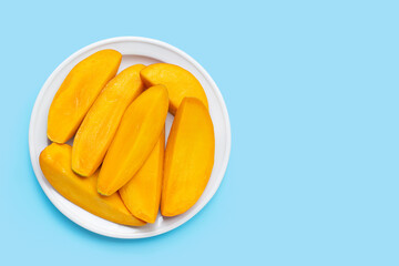 Tropical fruit, Mango on blue background. Top view
