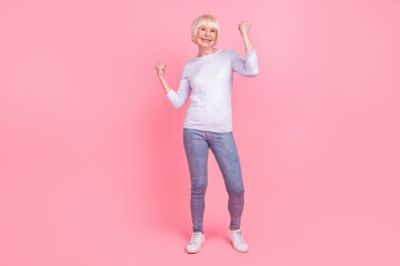 Full body photo of senior lovely woman rejoice victory success goal hooray discount isolated over pink color background