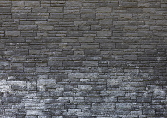 old masonry black stone wall
