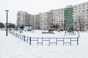 playground with slides in the yard in winter