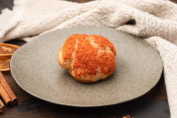 Bun, bun with cream dessert, on a wooden background.