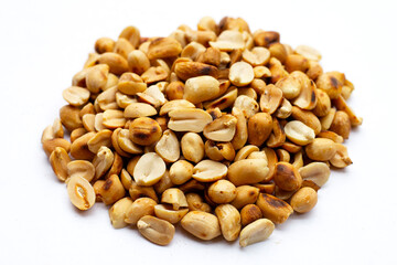 Roasted peanuts on white background.