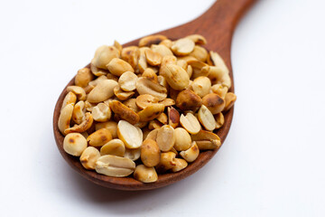 Roasted peanuts on white background.