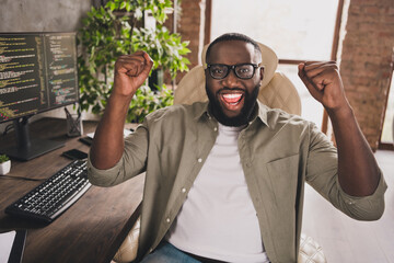 Portrait of attractive cheerful skilled lucky guy expert rejoicing having fun good project at...