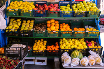 Various fruits are on sale in the street vendor