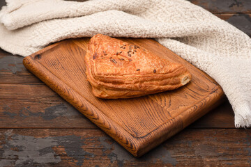 Samsa, samsa with different fillings, wooden background